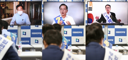 22일 서울 여의도 더불어민주당 중앙당사에서 열린 당대표 및 최고위원 후보 수도권 온택트 합동연설회에서 이낙연, 김부겸, 박주민 당대표 후보가 영상연설을 하고 있다. 이날 당대표 후보들인 김부겸, 박주민 후보는 코로나19 상황으로 자가격리 중인 이낙연 후보와의 형평성을 위해 모두 영상 연설로 대처했다.